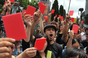 a group of slogan chanting demonstrators