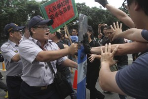 student demonstrators holding a sign rea